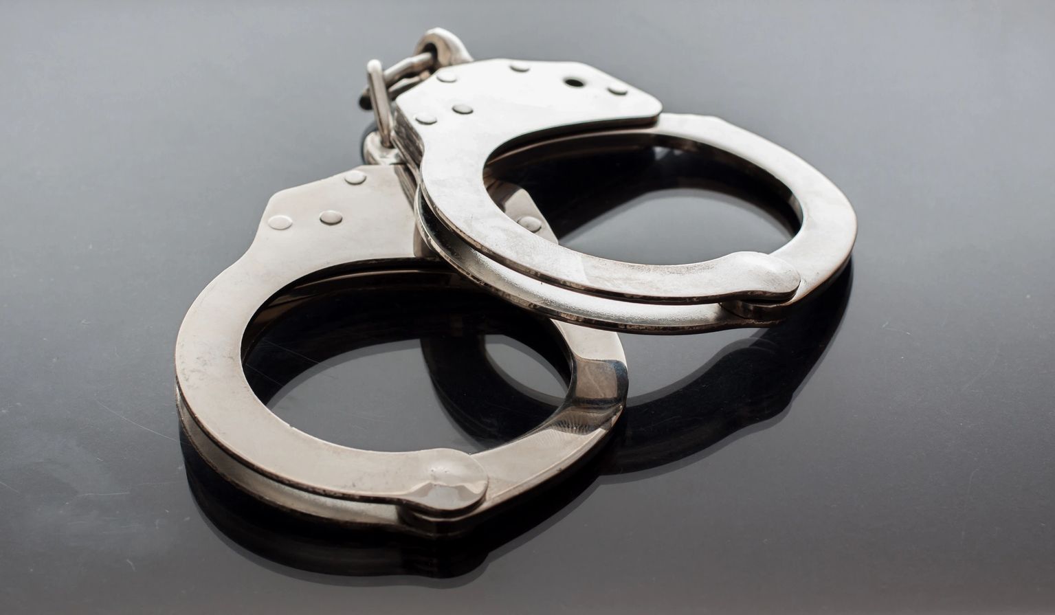 Steel handcuffs — call Bruny's Bail Bonds 24/7 at 302.494.6212